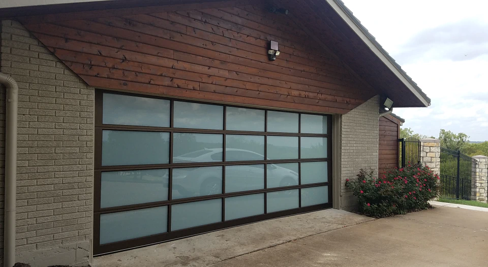 a newly installed garage door with natural light openings